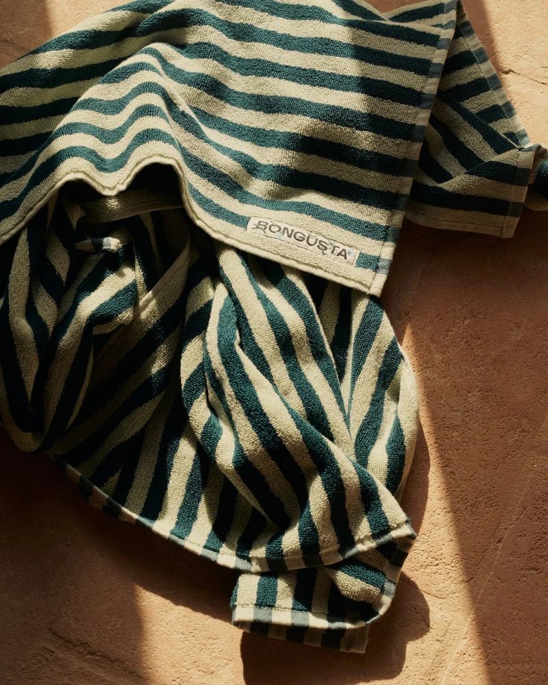 Bongusta Naram bathroom towel in sea foam and deep teal with soft, plush fabric, displayed folded on a bathroom surface