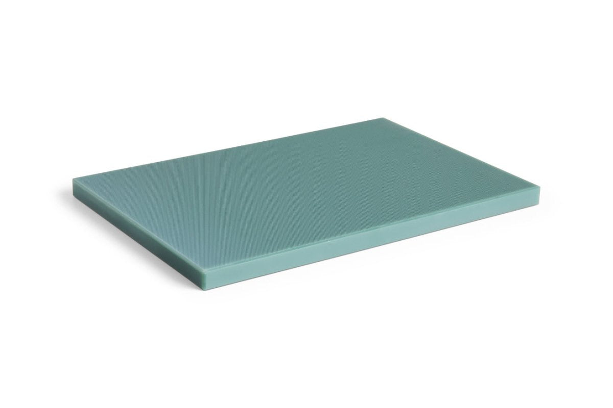 Large dark green HAY kitchen chopping board with a smooth surface and sturdy edges.