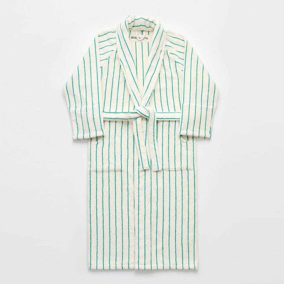 Bongusta Naram bathrobe in pure white and grass green, soft and cozy bathroom robe displayed on a hanger.