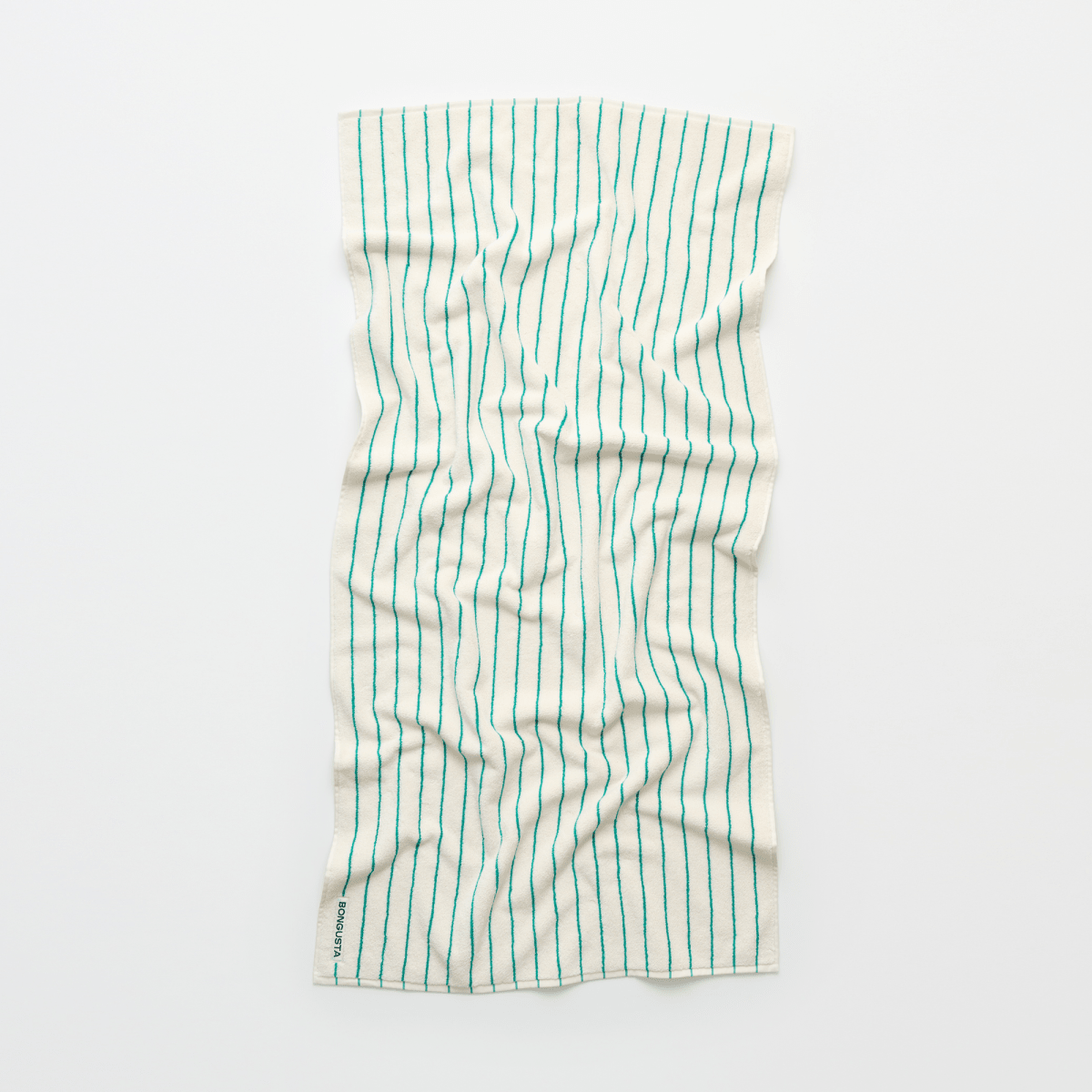 Bongusta Naram bathroom towel in pure white and grass green, soft and plush fabric for luxurious bathroom use.
