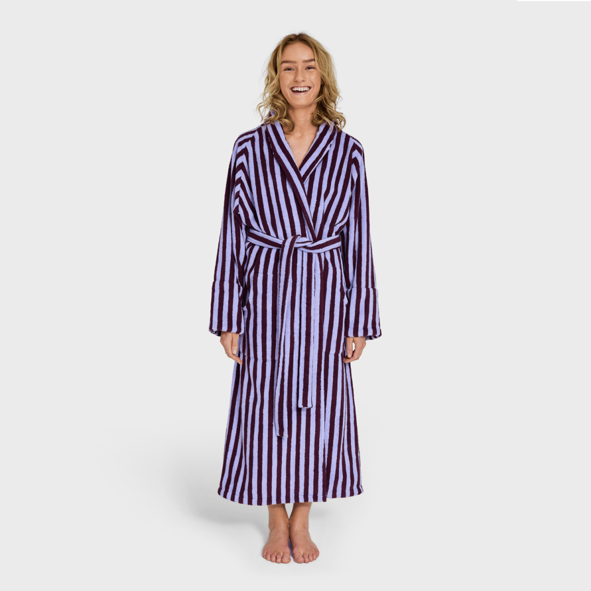Bongusta Naram bathrobe in wine and lavender blue, soft and plush bathroom robe shown folded with fabric texture visible.