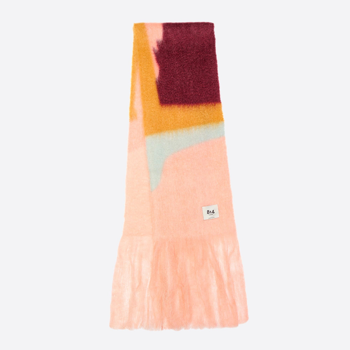 Views Mohair Scarf by 814 Ezcaray, a soft, cozy accessory in neutral tones, draped elegantly to showcase its lightweight, luxurious fabric.