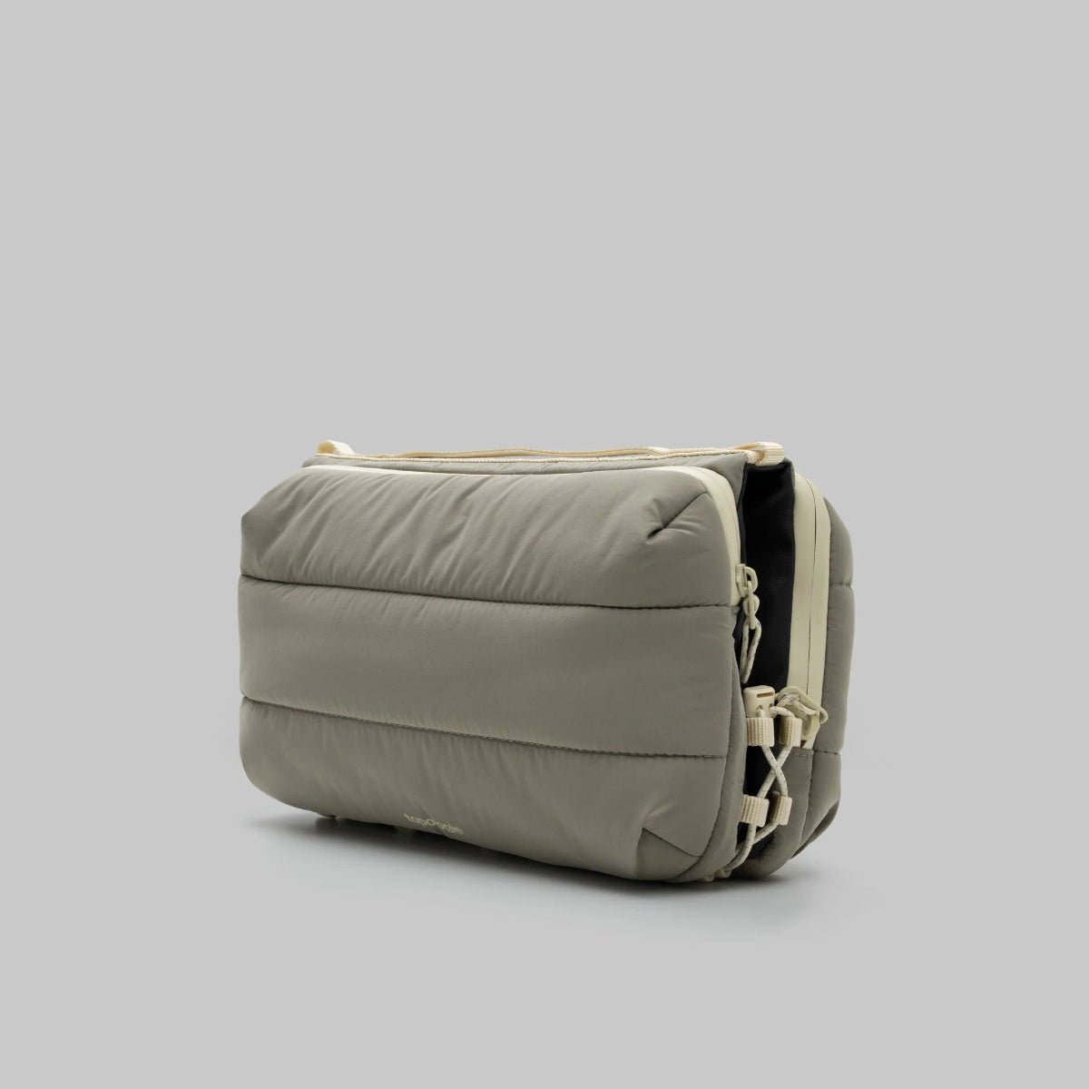 Large moss putty bottle bag from topologie on a grey background