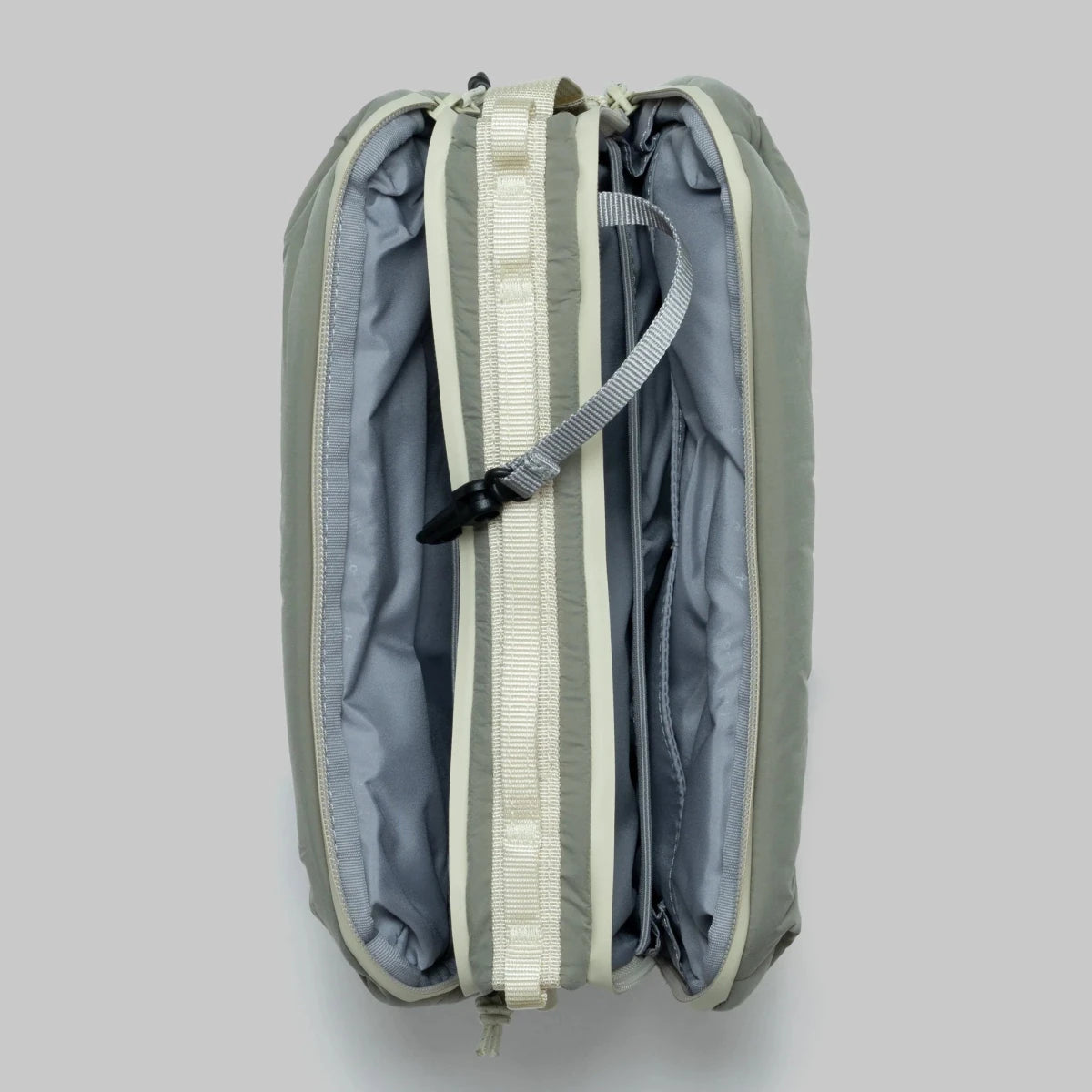 Large moss putty puffy bottle bag from topologie on a grey background