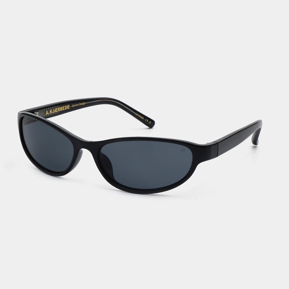 A pair of A. Kjaerbede Alexa sunglasses with black frames and dark tinted lenses, stylish and modern for sun protection.