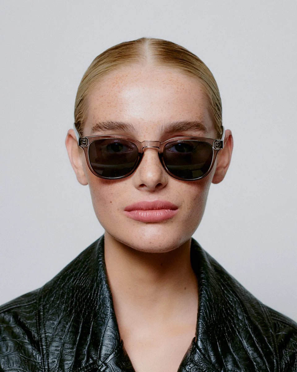 Grey transparent Bate sunglasses by A. Kjaerbede with sleek, modern design and tinted lenses