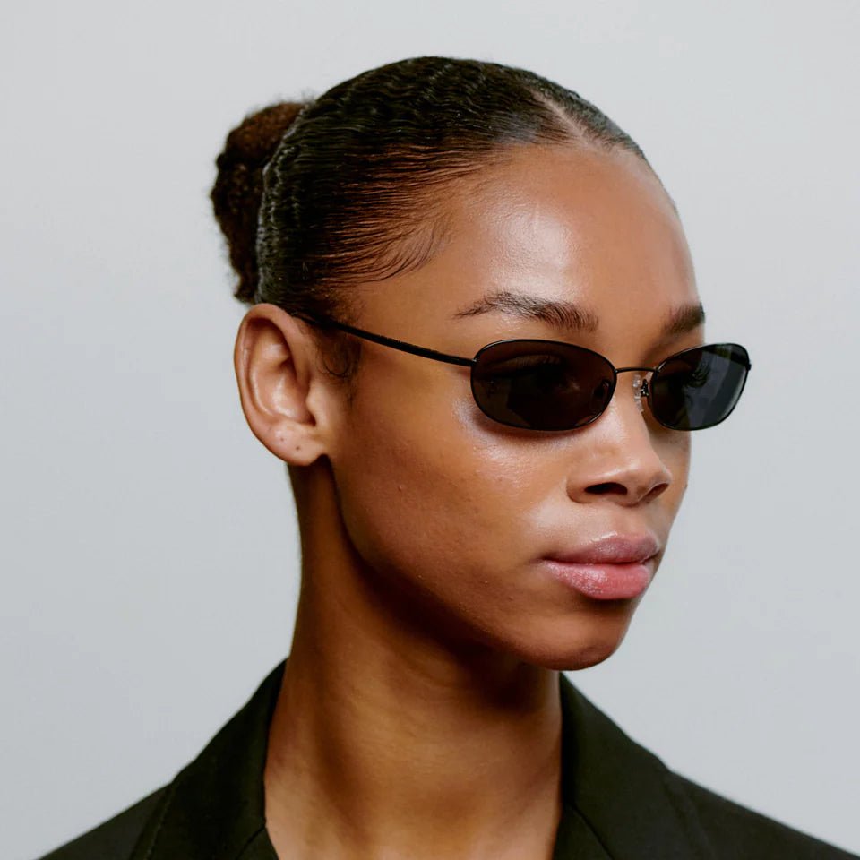 A. Kjaerbede Jack sunglasses with round frames, dark lenses, and metal accents on the temples, stylish eyewear for everyday wear.