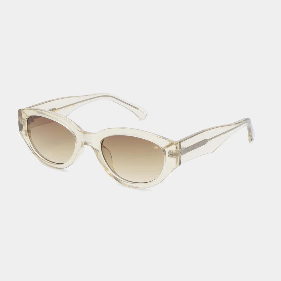 A. Kjaerbede Winnie sunglasses with rounded black frames and dark tinted lenses, stylish eyewear for sun protection.