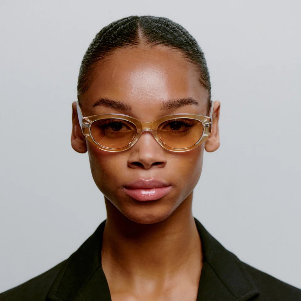 A. Kjaerbede Winnie sunglasses with round frames and dark tinted lenses, stylish and trendy for everyday wear.