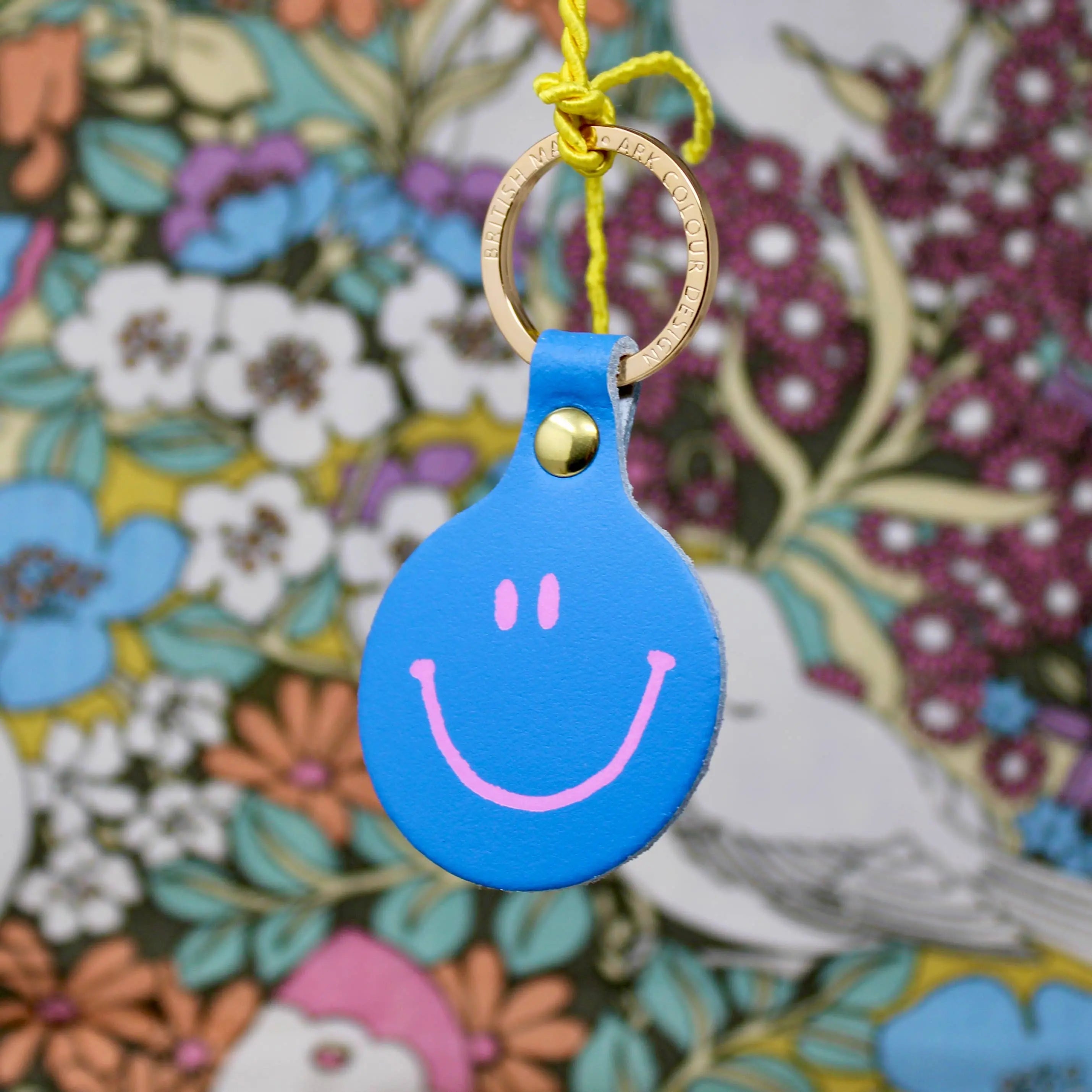 Feeling Lush Smilie Face Key Fob by Ark Colour Design in cornflower blue, featuring a cheerful smiling face design.