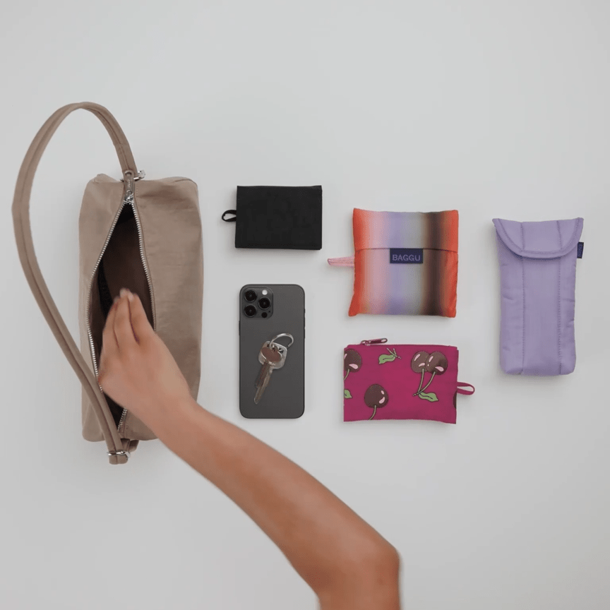 Nylon loaf bag by Baggu with adjustable strap and spacious interior, shown in black with subtle branding details.