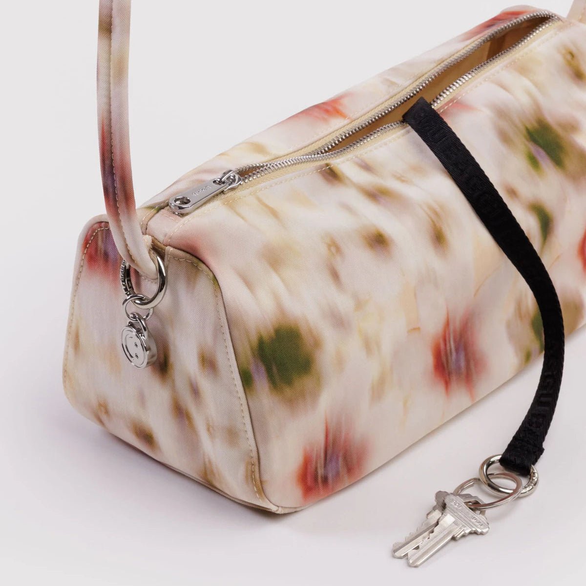 Nylon Loaf Bag by Baggu featuring a soft, flexible nylon material with a rounded shape and top handle for carrying.