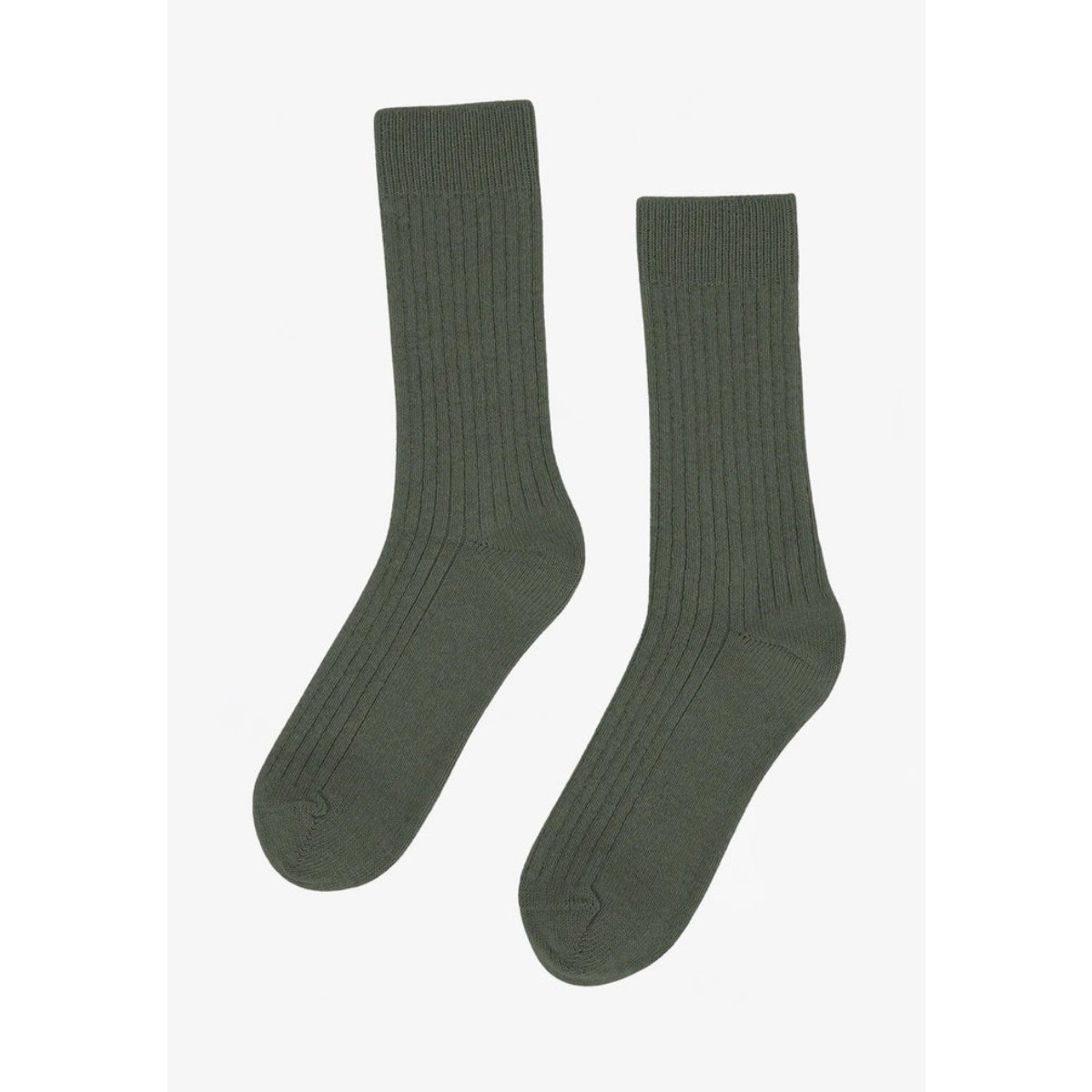 Colorful Standard merino wool blend socks in vibrant, multi-colored patterns, showcasing soft, cozy knit design and ribbed cuffs.