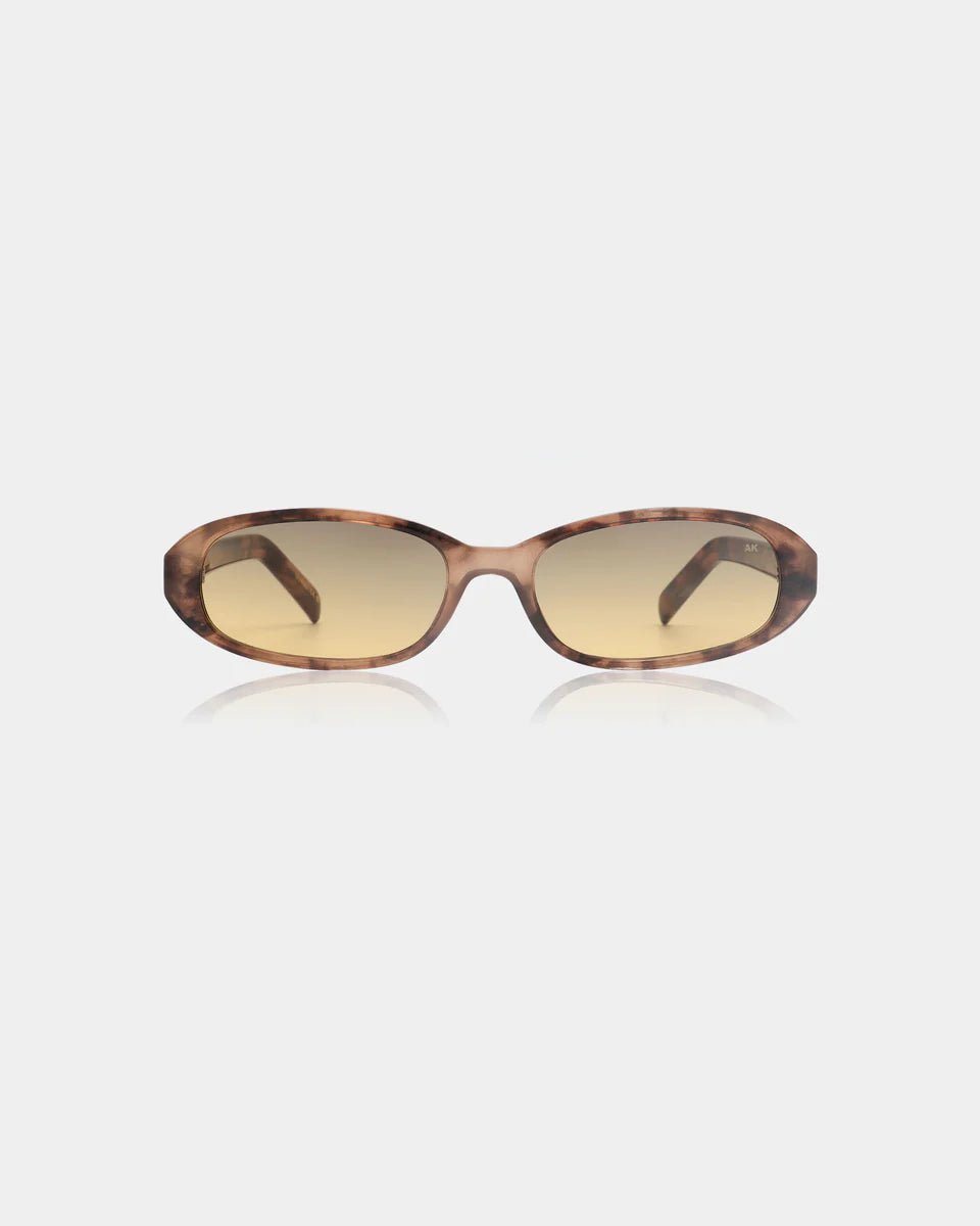 A. Kjaerbede Macy sunglasses with rounded frames and dark lenses, displayed on a neutral background.