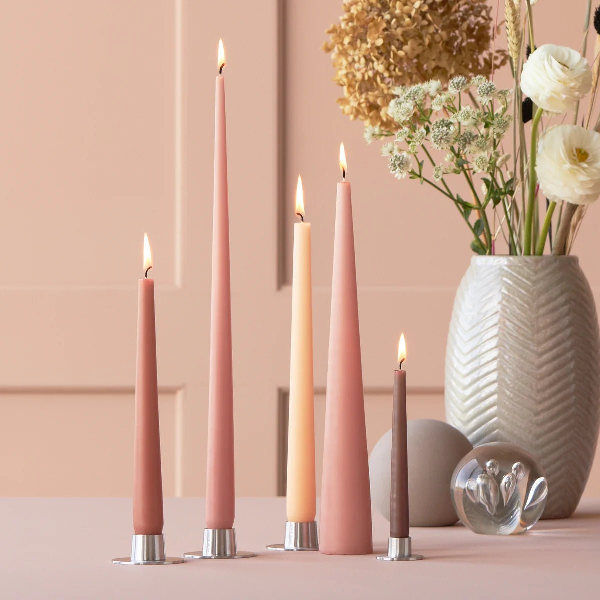 Set of Ester & Erik cone candles in various sizes with warm, natural wax finish, perfect for cozy home decor.