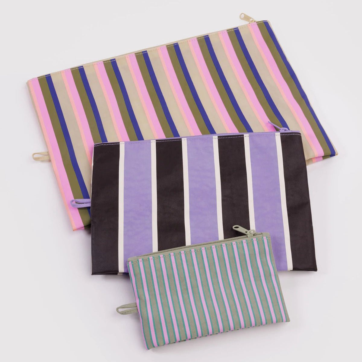 Set of striped fabric pouches on a white background