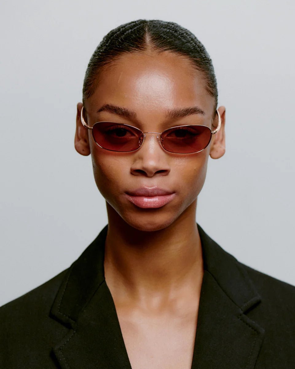 Gold-rose A. Kjaerbede Jack sunglasses with sleek frame and tinted lenses, stylish eyewear for sun protection.