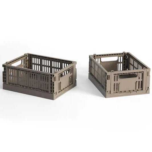 Set of two colorful HAY Mini Colour Crate storage bins for organization and tidy storage.