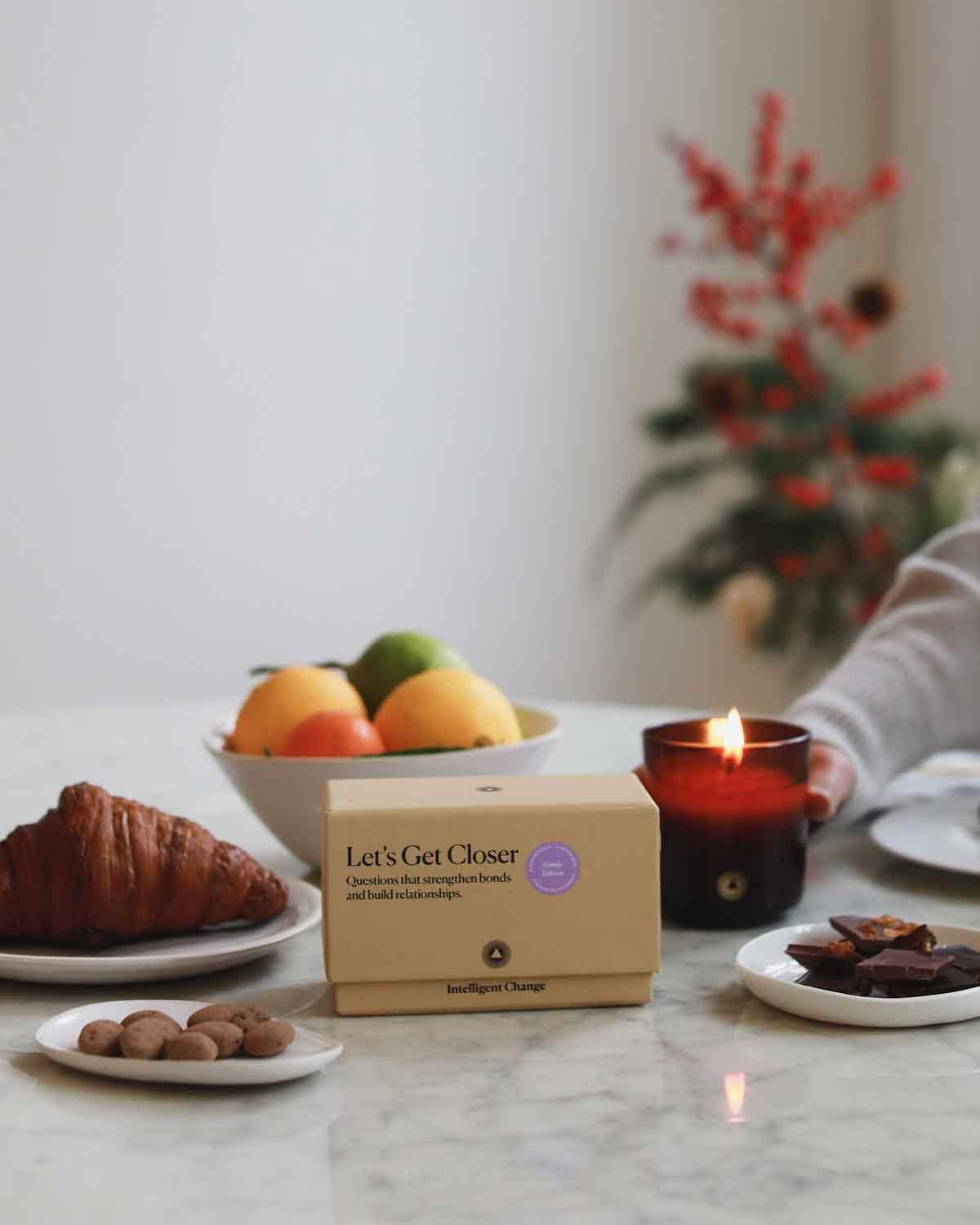 Let's Get Closer Family Edition bonding question card game by Intelligent Change, featuring colorful cards for family conversations.