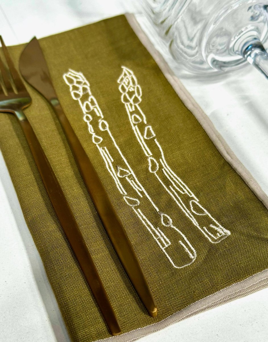 Set of two linen blend napkins with asparagus print by MÆGEN, featuring elegant, natural fabric design for dining or decor.