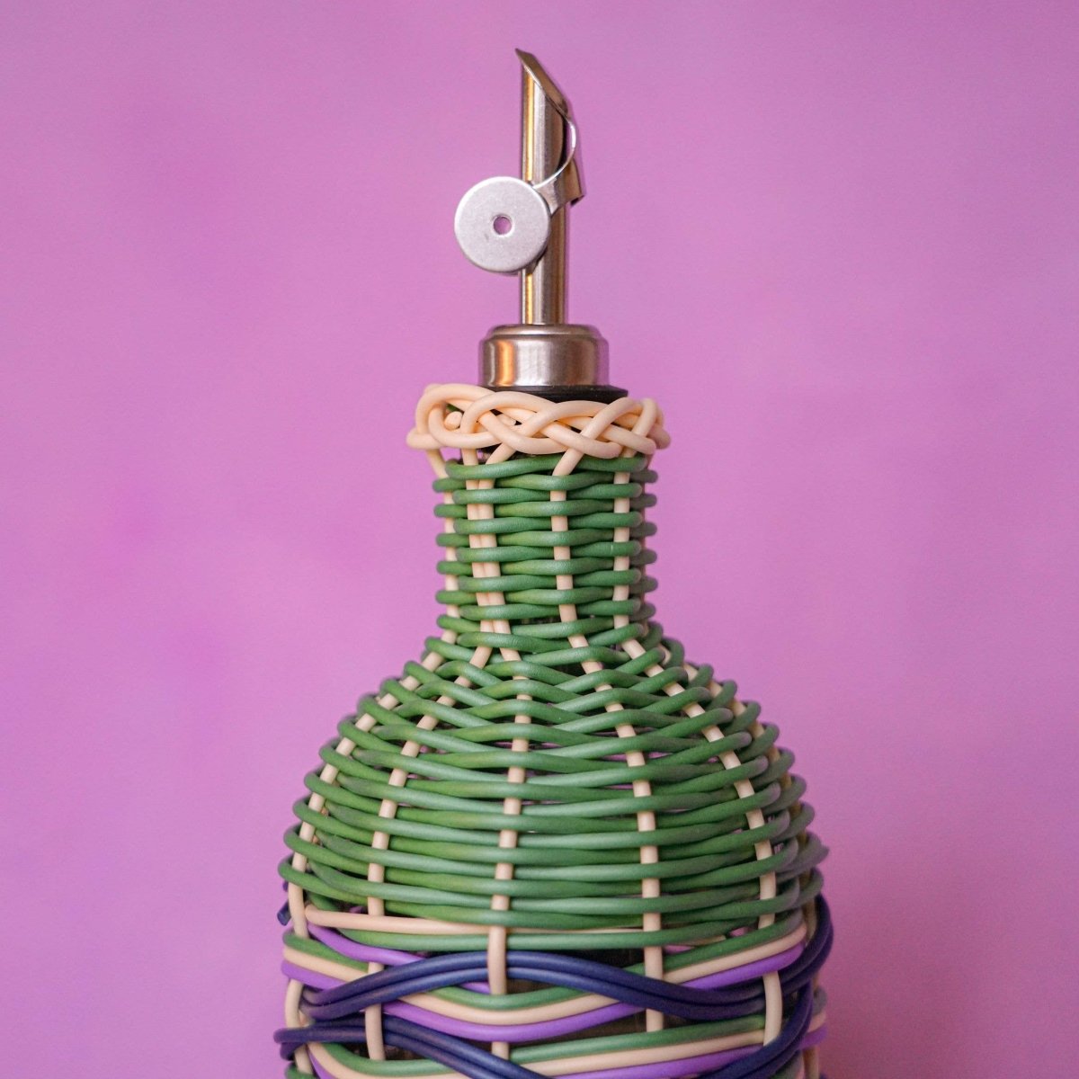 Brown and green Maegen Oil Pourer by MÆGEN with a sleek, ergonomic design for easy pouring and controlled oil flow.
