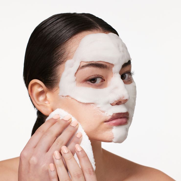 Malin+Goetz Detox Face Mask in a sleek jar, with creamy texture and natural ingredients visible, for deep cleansing skincare.