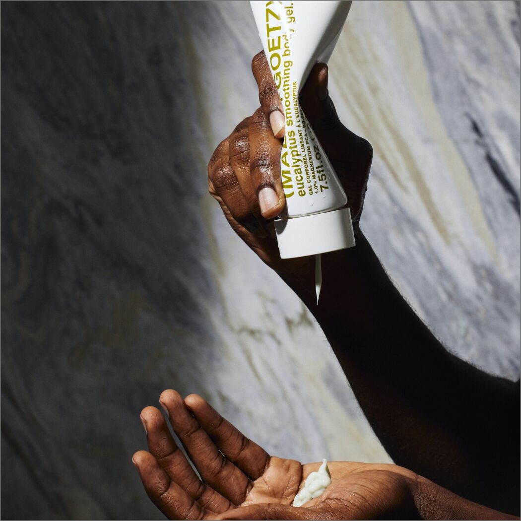Malin+Goetz Eucalyptus Smoothing Body Gel 220ml with clear gel texture and fresh eucalyptus scent for soothing skincare.
