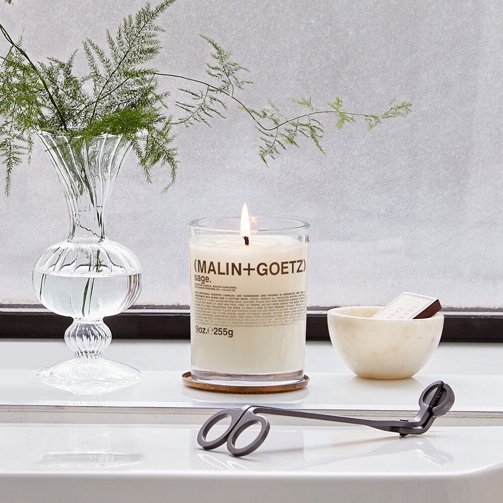Malin + Goetz Sage Candle 255g with natural sage aroma, designed for a relaxing skincare ambiance.