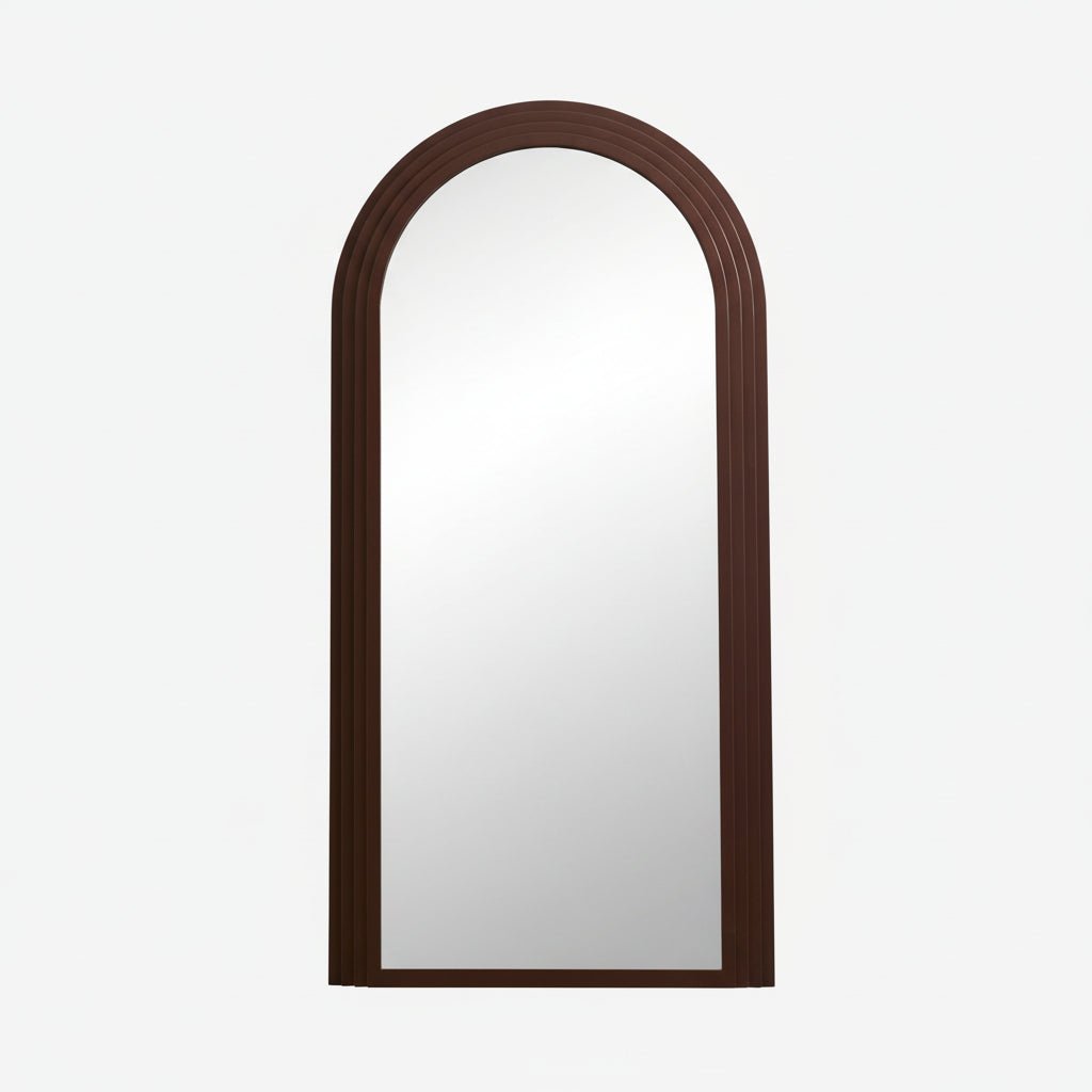 Rust-colored FALCO mirror by Nordal A/S featuring a sleek, round frame and modern design, hanging on a wall.