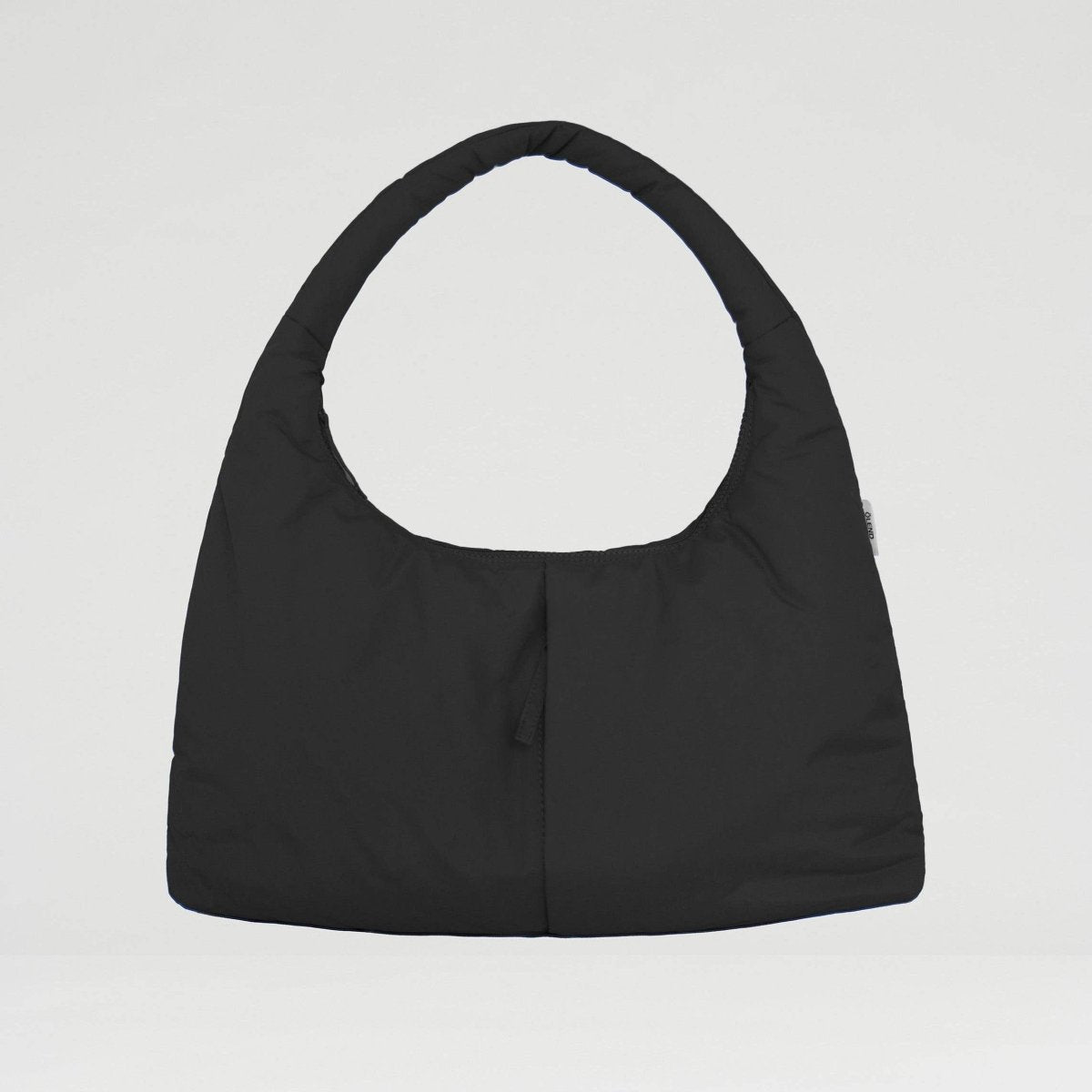 Black handbag on a light gray background