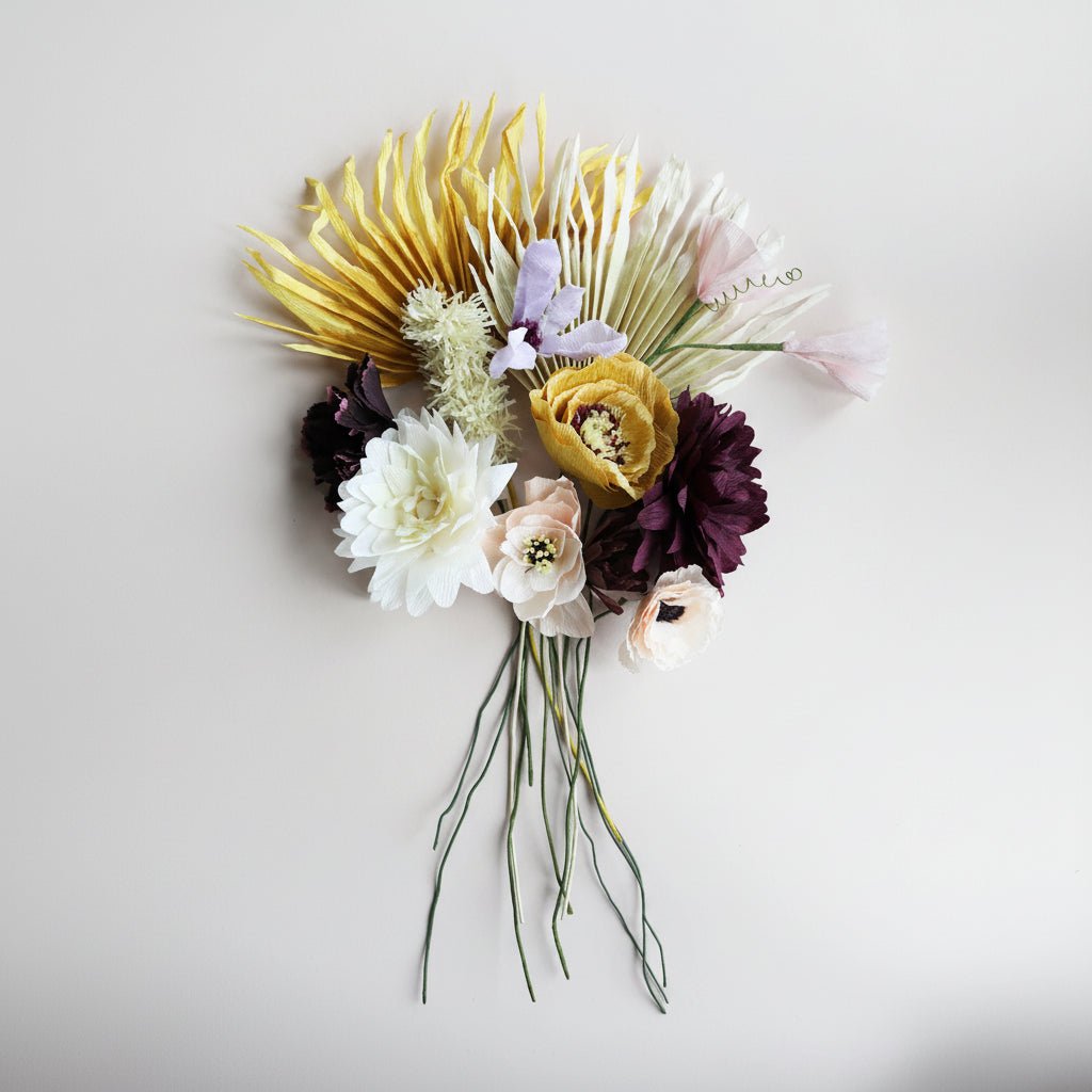 Bouquet of flowers with yellow, white, and purple colors on a light background