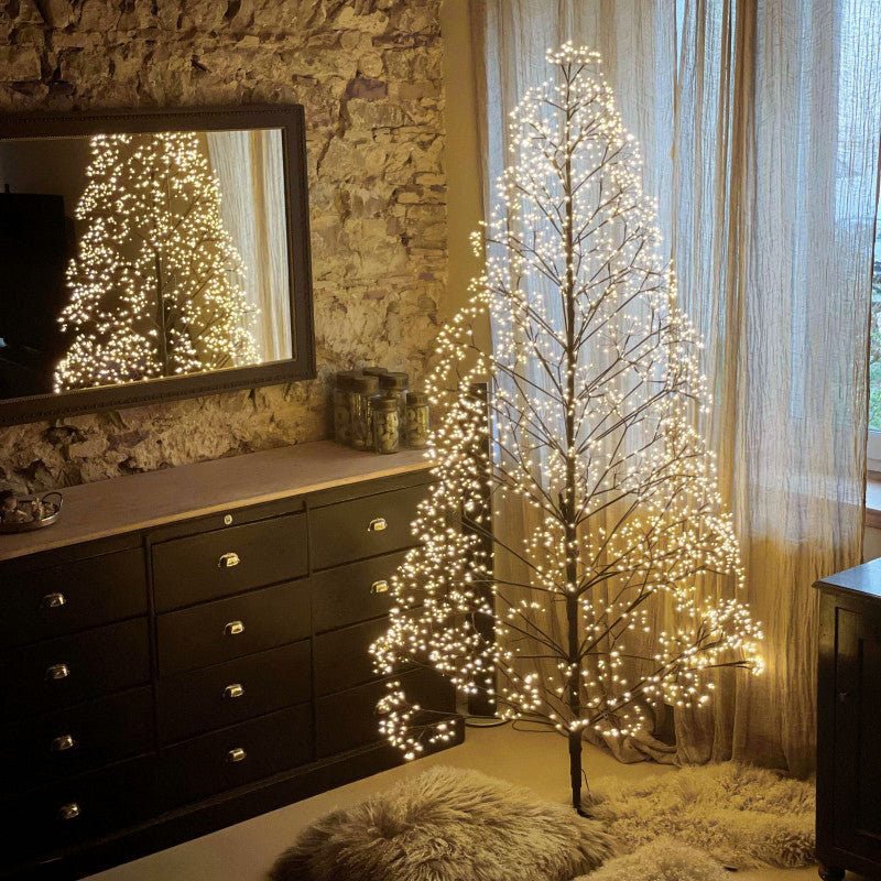 LED Pine Christmas Tree by Fiorira un Giardino, 180cm, indoor/outdoor, decorated with warm white lights and realistic pine branches.