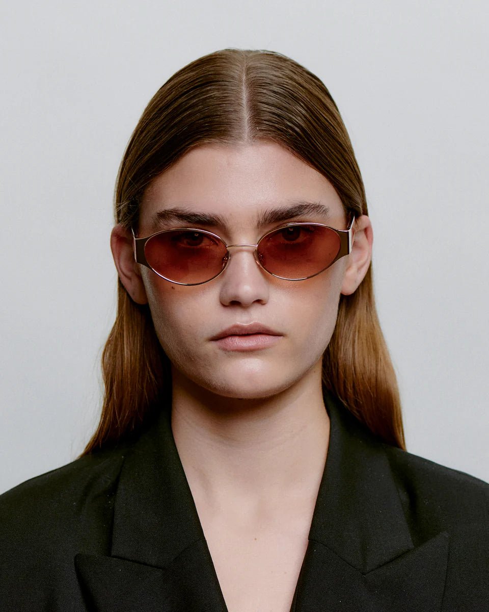 Rosegold Havana Bella sunglasses by A. Kjaerbede with rounded frames and tinted lenses, stylish and fashionable eyewear.