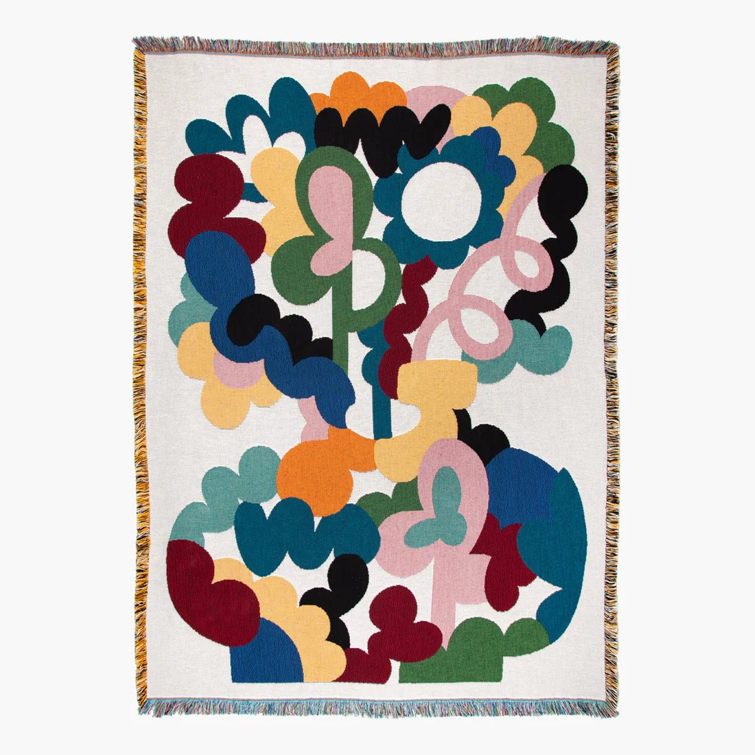 Colorful abstract patterned blanket on a white background