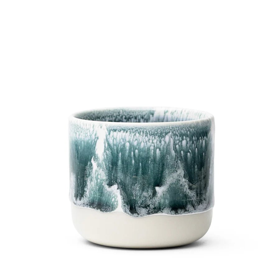 Studio Arhoj Andromeda Green ceramic Quench Cup with a vibrant green glaze and unique artistic design.