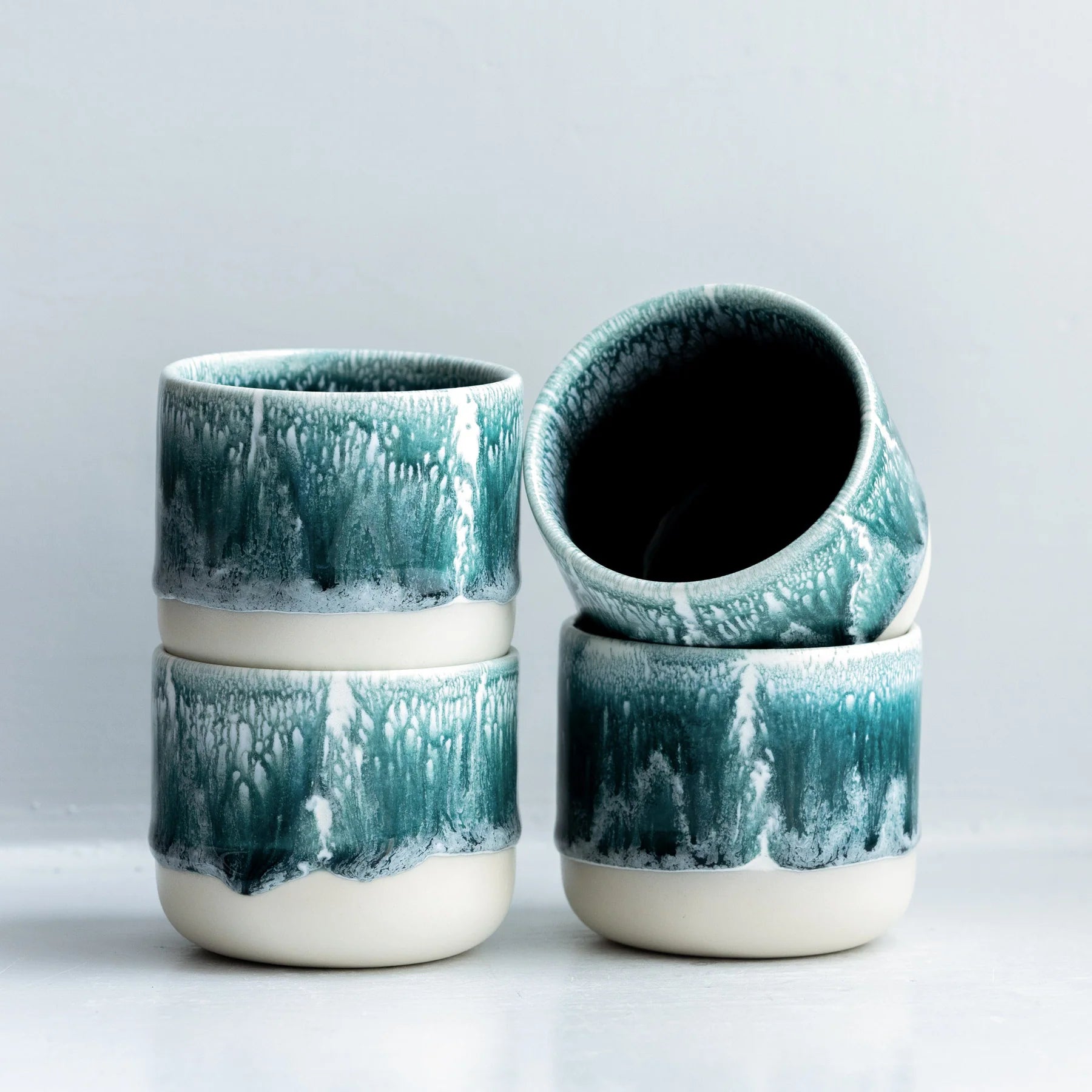 Studio Arhoj Andromeda Green ceramic Quench Cup with a smooth, rounded shape and glossy finish.