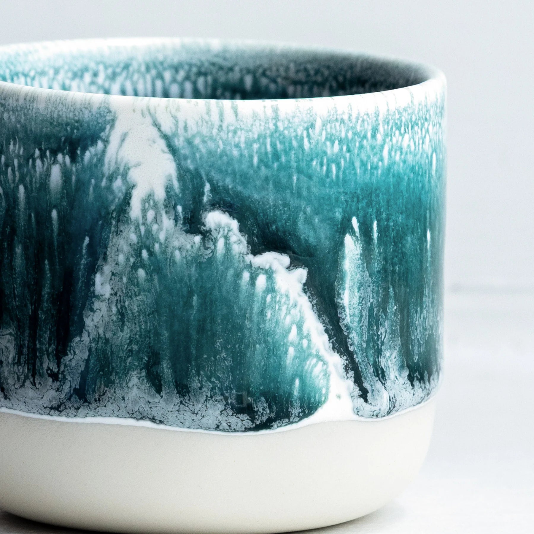 Studio Arhoj Andromeda Green ceramic Quench Cup with a glossy, vibrant green glaze and unique handcrafted design.