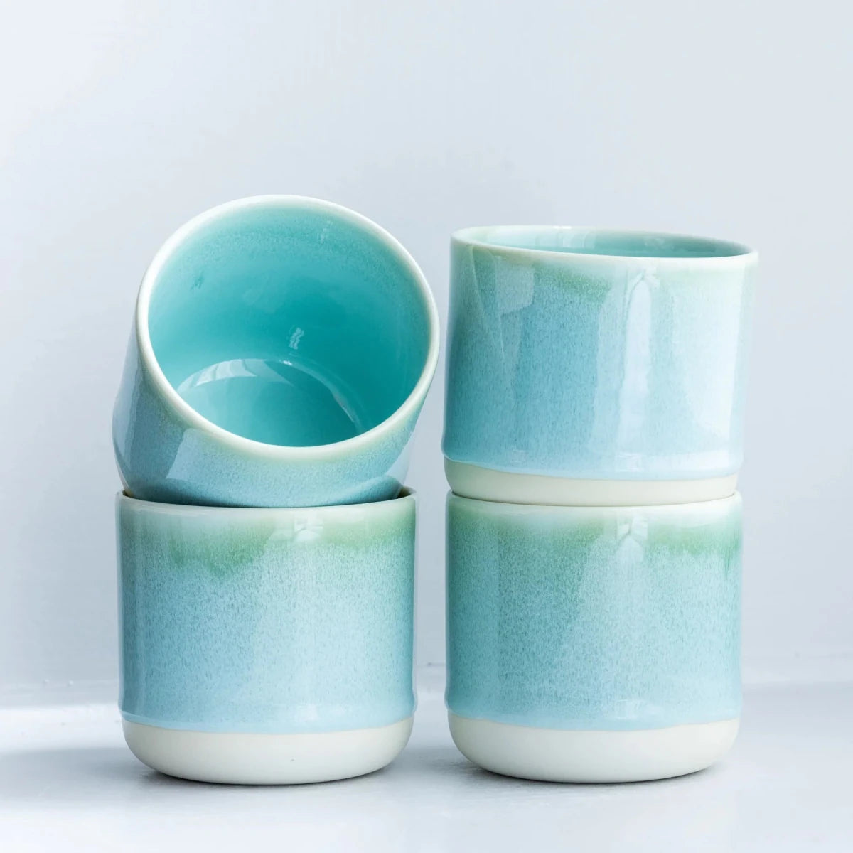 Studio Arhoj Finland Forest Green ceramic Quench Cup with a smooth, glossy finish and vibrant green color.