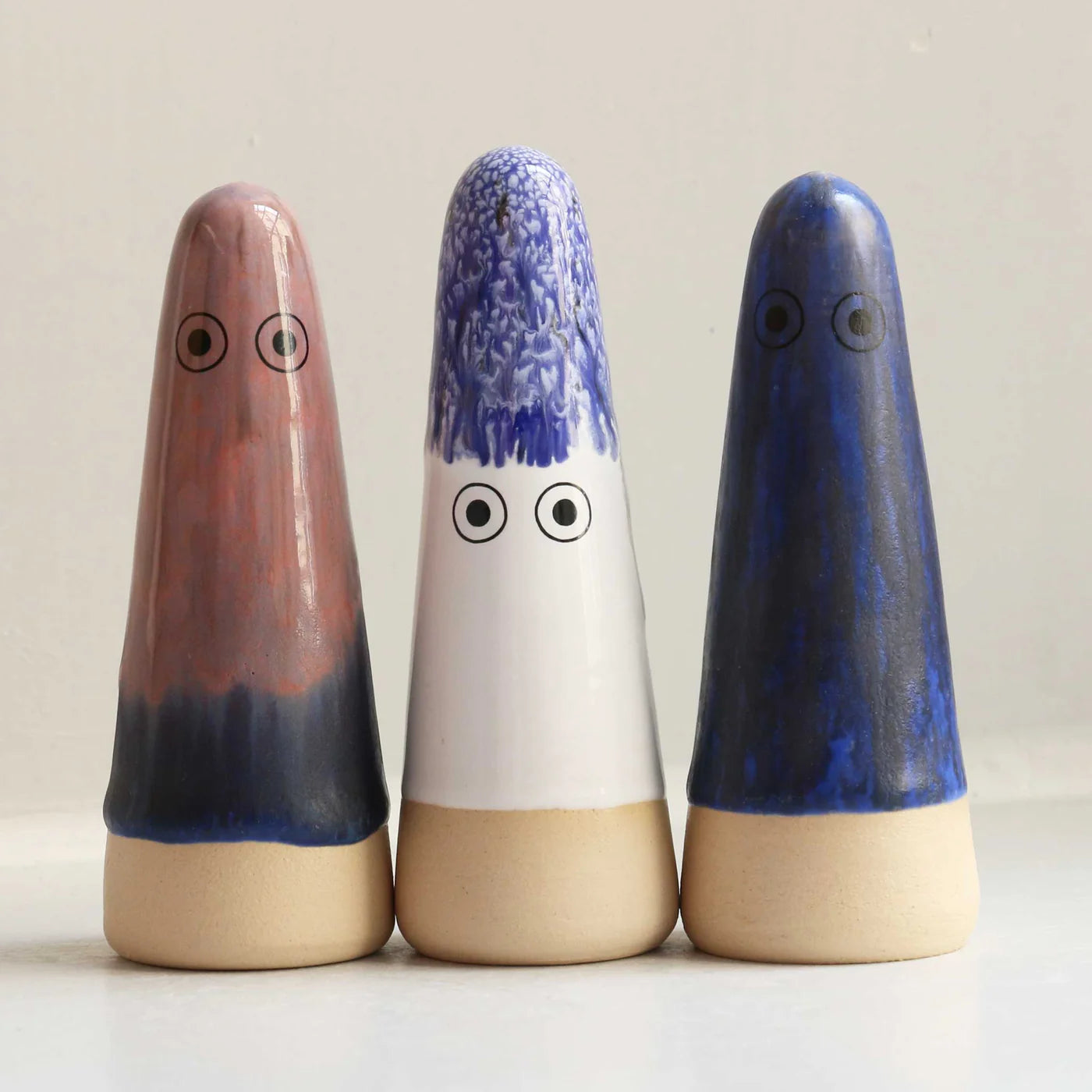 Studio Arhoj ceramic Ghost figurine with a smooth, glossy white finish and detailed facial features.