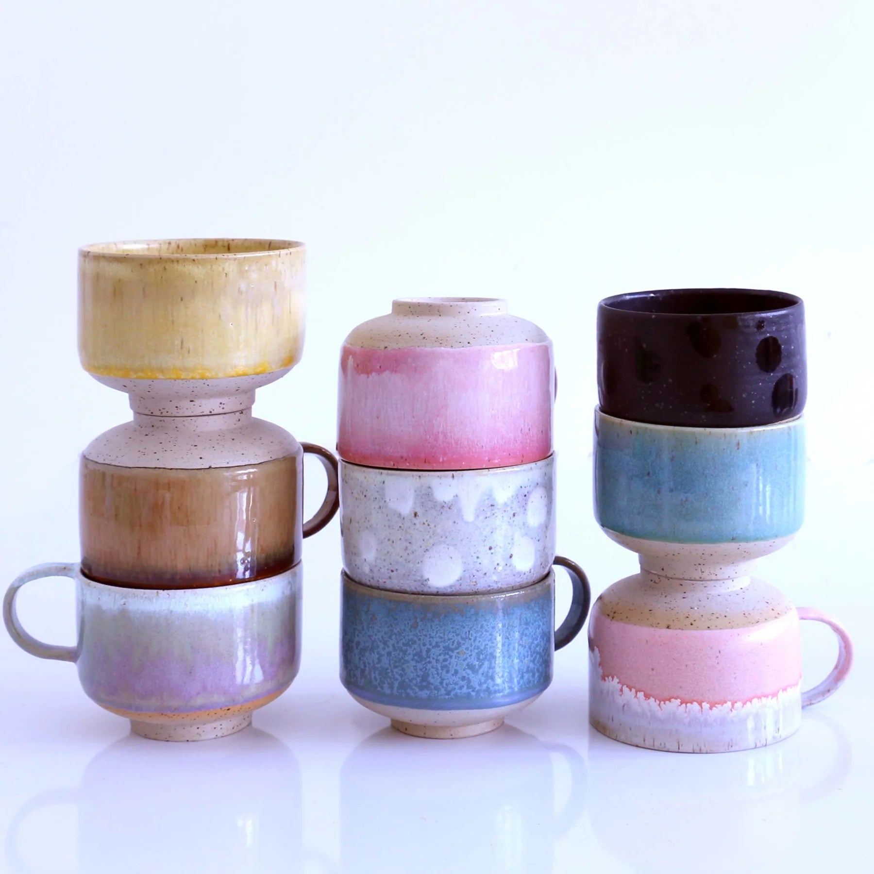 Studio Arhoj Zephyr Ceramic Mion Mug featuring a colorful, handcrafted design with a smooth handle and glossy finish.