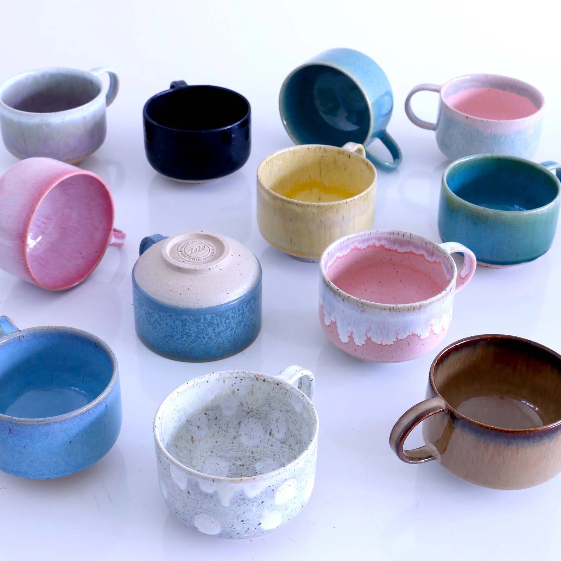 Studio Arhoj Zephyr ceramic Mion mug with a smooth, glazed finish and unique artistic design.