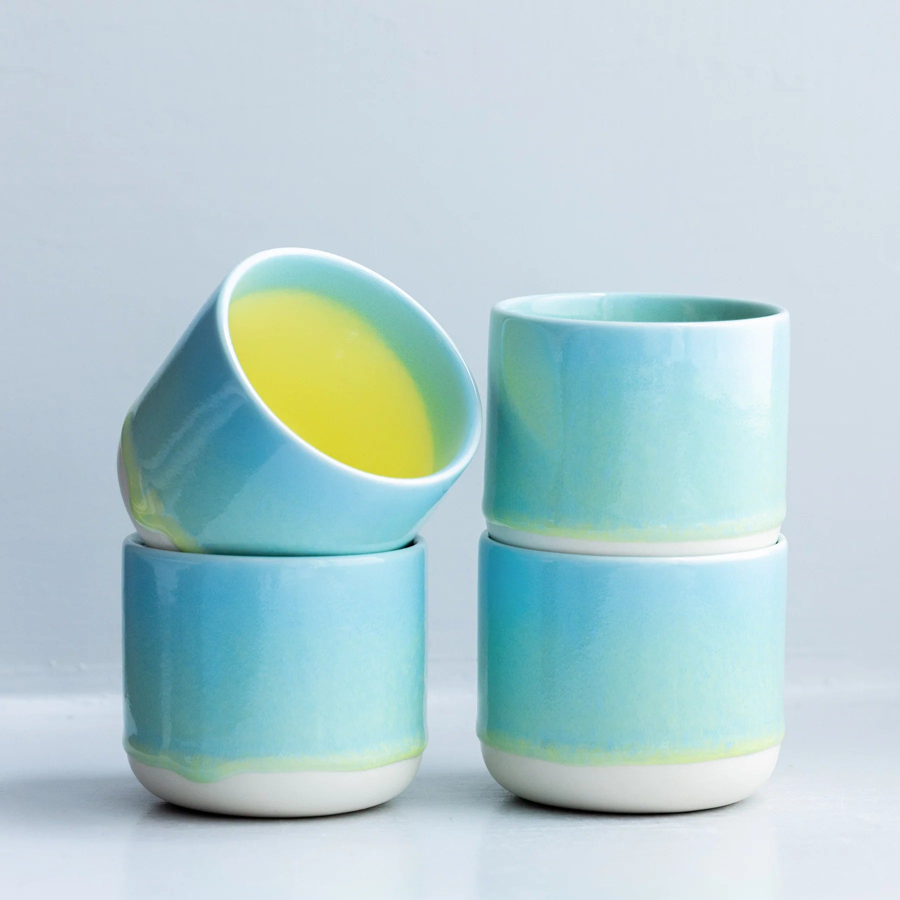 Yellow Snapper ceramic Quench Cup by Studio Arhoj featuring a vibrant, whimsical fish design on glossy ceramic.