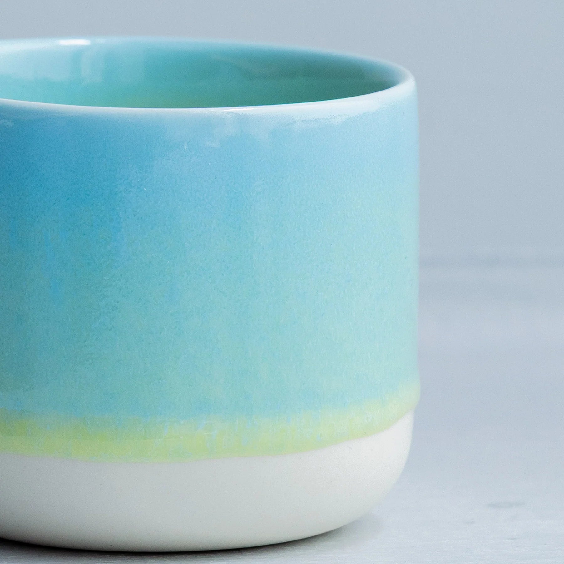 Yellow Snapper ceramic Quench Cup by Studio Arhoj featuring a colorful, whimsical fish design on a glossy ceramic surface.