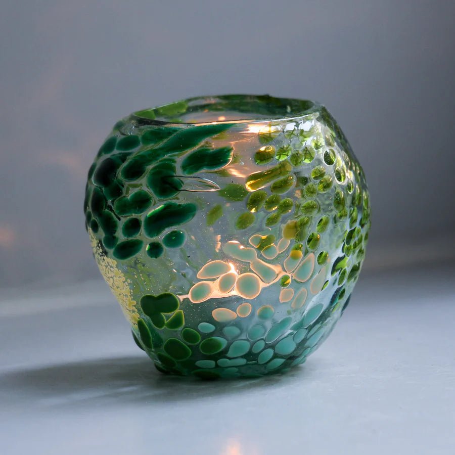 Colorful glass urchin sculpture by Studio Arhoj, showcasing vibrant hues and intricate glass art craftsmanship.