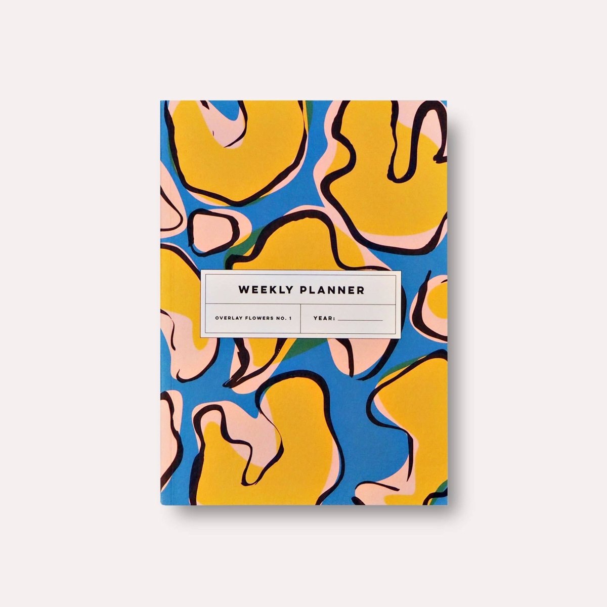 Overlay Flowers No. 1 weekly planner book by The Completist featuring a floral cover and lay-flat design for easy planning.