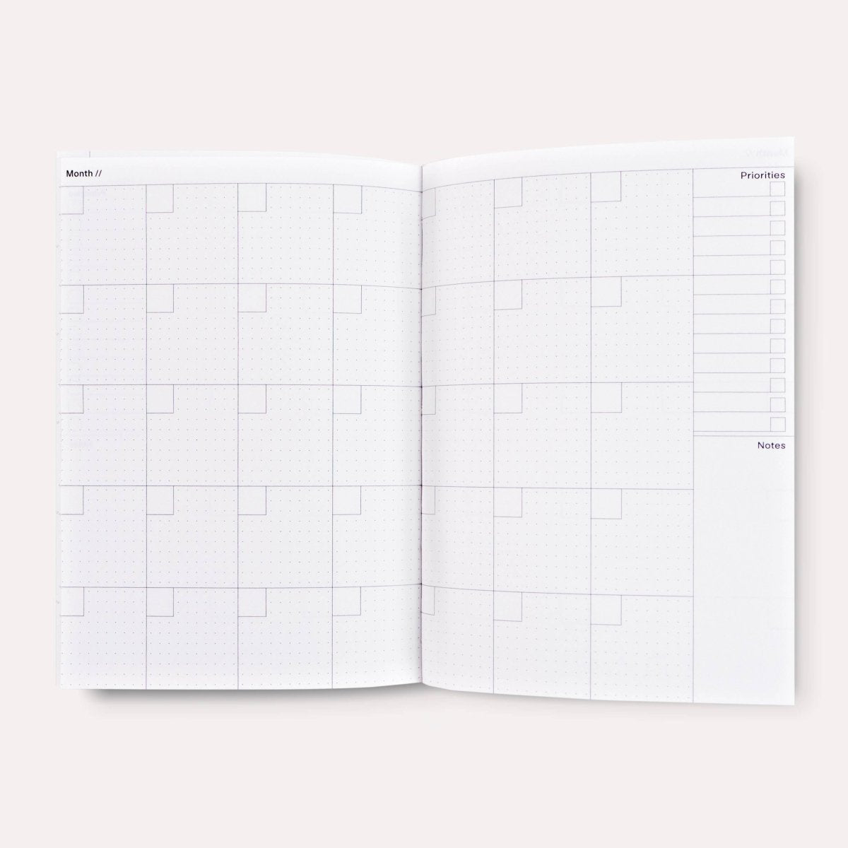 Overlay Flowers No. 1 weekly planner book by The Completist, featuring a floral cover and lay-flat design for easy planning.
