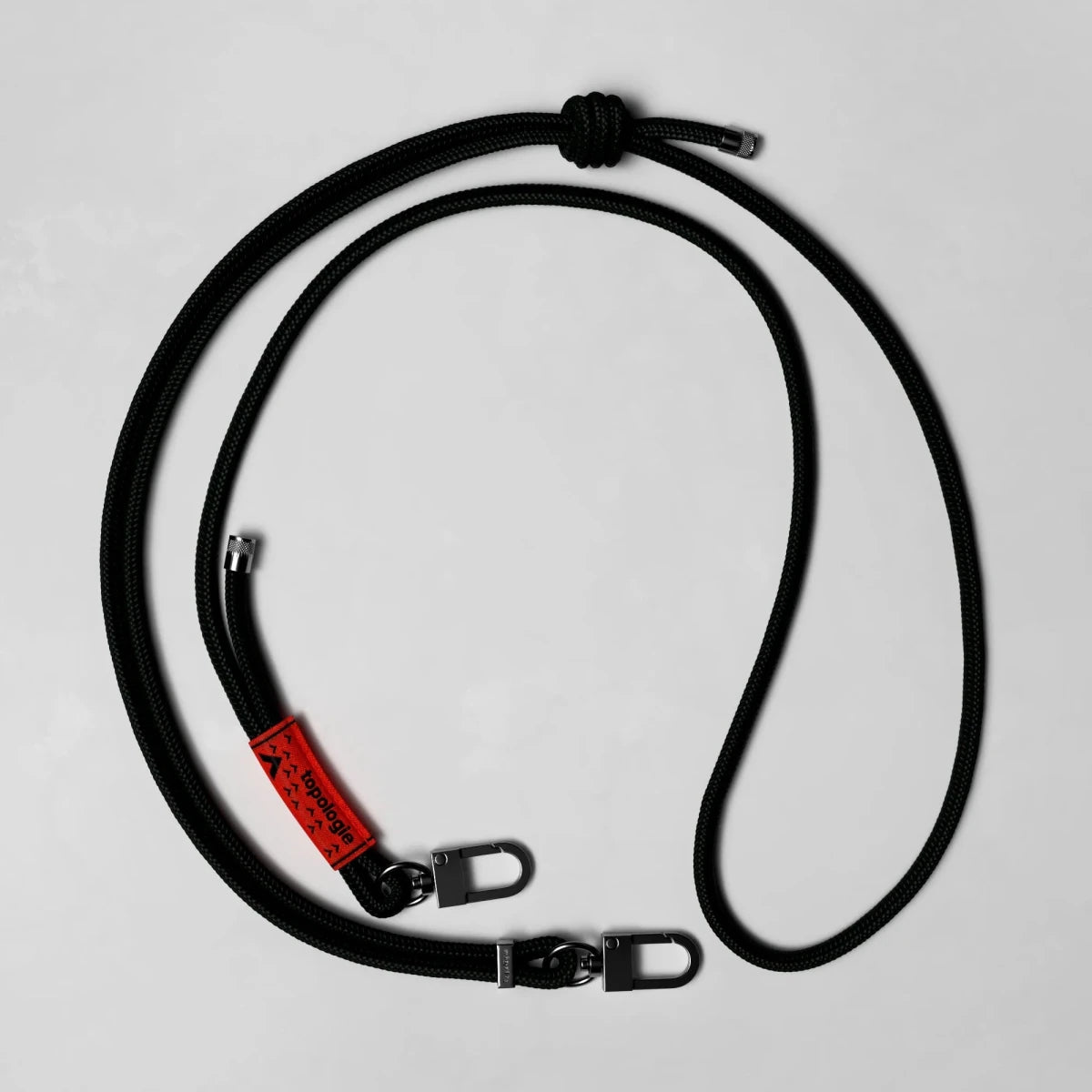 Close-up of a 6.0mm Topologie rope strap showing its textured fabric and secure metal buckle for durable, stylish accessories.