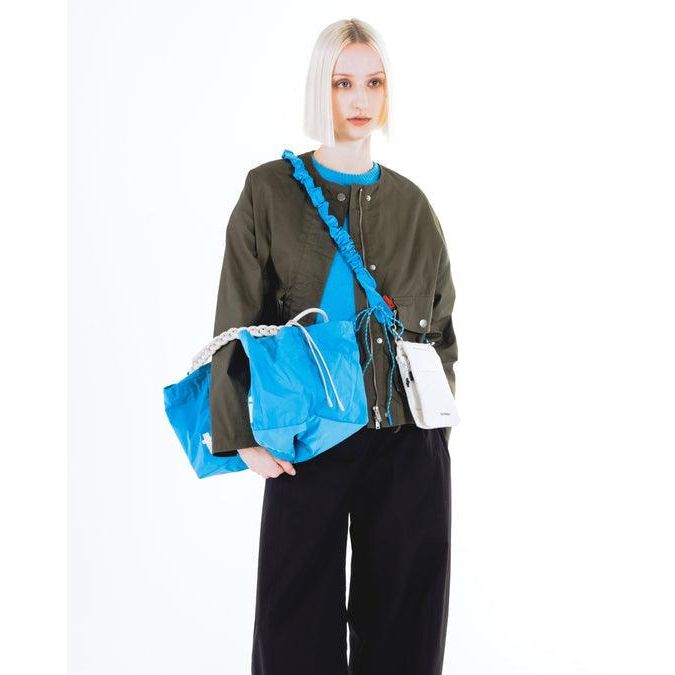 Topologie Bungee Strap for Bags, adjustable elastic strap with black nylon and metal clips, suitable for securing and carrying bags.