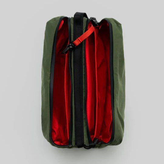 Large Topologie Bottle Sacoche bag with adjustable strap and durable material, designed for convenient carrying of bottles.