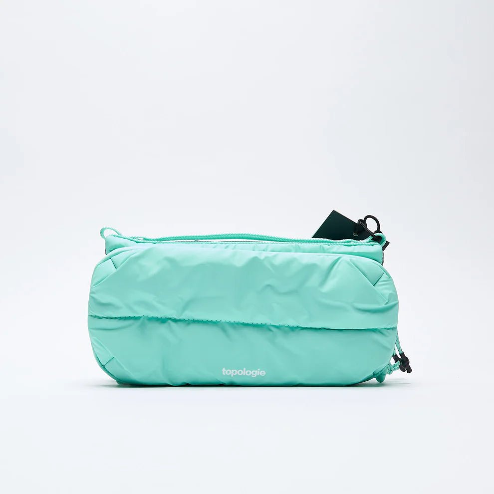 Light mint pouch with 'topologie' branding on a white background